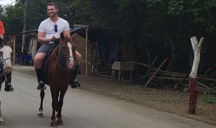 The Vacationer's Phil Dengler on a Horse in Ecuador